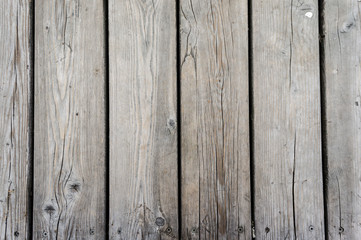 Fototapeta premium rustic weathered barn wood background with knots and nail holes