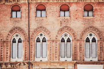Bologna, Italy. Windows on the wall of the Palazzo Communale