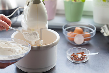 Baking cake. Next stages, following stages. We add flour.