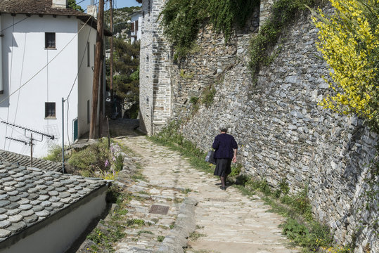 Greek widow walking in a village, Makrinitsa, Greece