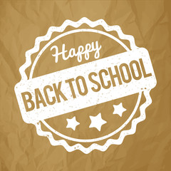 Back to School rubber stamp white on a crumpled paper brown background.