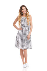 Smiling Woman In White Dotted Dress Isolated On White