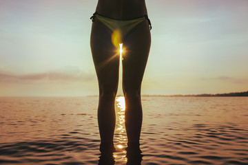 sunrise between woman legs