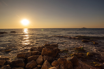 Sunset on rocky coast of Black Sea