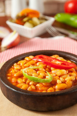 Beans in a wooden bowl closeup - Güveç Kuru Fasulye
