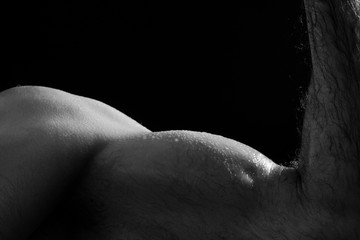 Naklejka premium Closeup of arm on black background