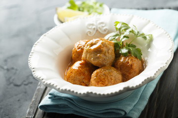 Meatballs in tomato and sour cream sauce