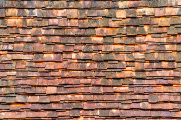 Old red clay tiles roof pattern