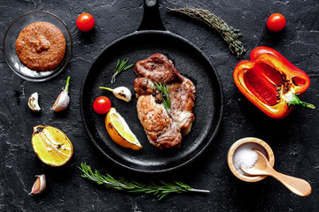 concept cooked steak on dark background top view