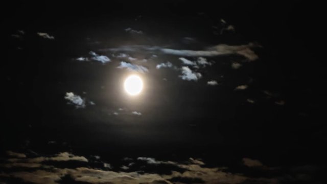 time lapse video of the moon coming through the clouds