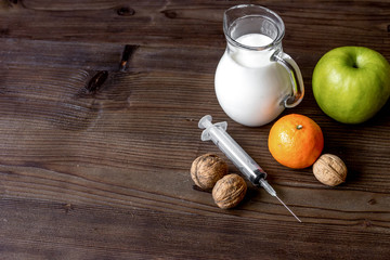 concept food allergies on wooden background