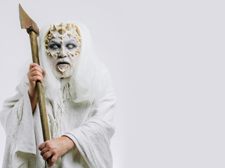 Demon with axe in hands on white background.