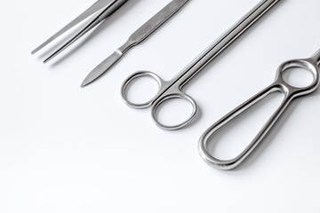 instruments for plastic surgery on white background