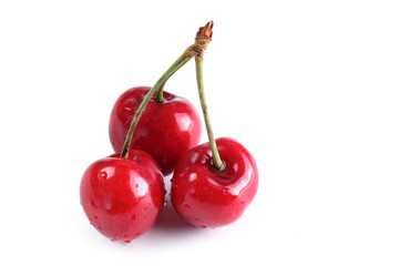 Fresh ripe cherries on white background