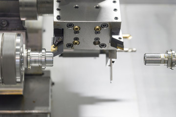 CNC lathe machine or Turning machine drilling  the steel rod .Hi technology manufacturing process.