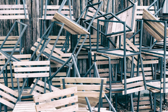 wooden chairs in random disarray