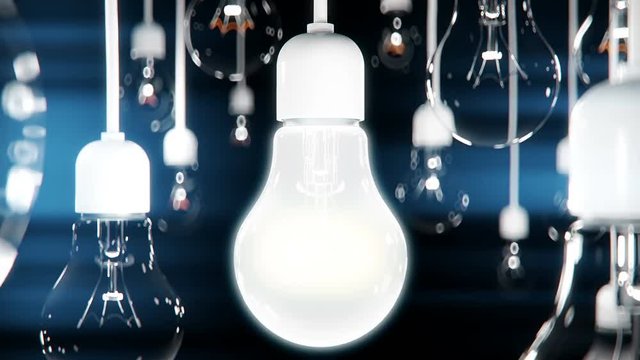 Idea concept with light bulbs on black background.
The camera zooms to bulb lamp. lamp turns on.