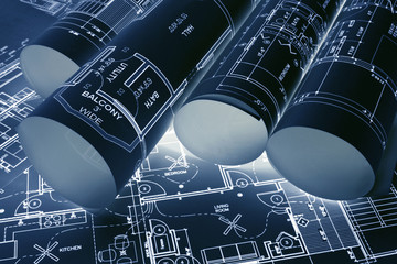 House blueprints, blue print style floor plans on architects desk, blueprint of a house from a high angle, engineering drawings blueprints and house plan blueprints rolled up