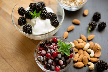 Healthy snack with fresh berries and almonds