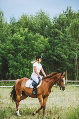 Girl jockey riding a horse