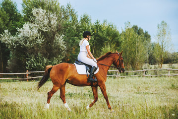 Girl jockey riding a horse