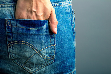 Teen fashion, hand of a girl in a pocket of a denim skirt