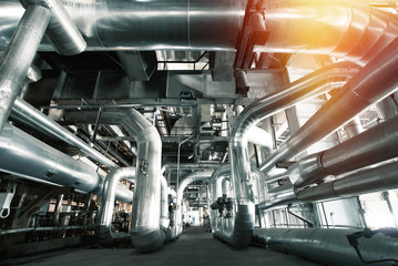Fototapeta premium Equipment, cables and piping as found inside of a modern industrial power plant