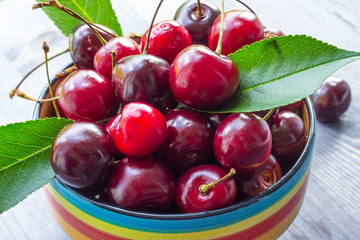 Cherry berries on a wooden background. Close-up. Selective focus.
