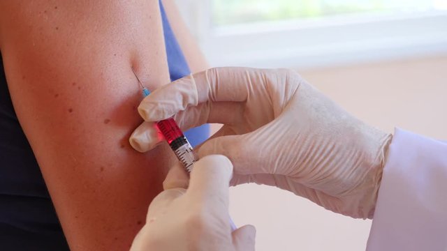 closeup of injection vaccine, 4K. Slow motion.