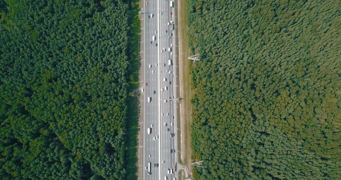Aerial view on a wide highway with heavy traffic.