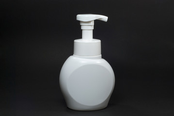 White cosmetic package with black background