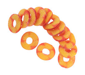 Several peach flavored candy rings isolated on a white background.