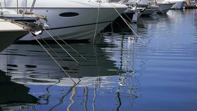 Yachts reflects in ripples water