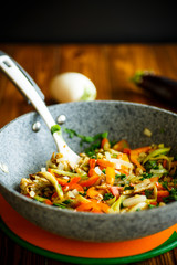 Warm summer salad of fried vegetables with tomatoes