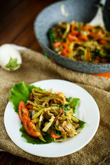 Warm summer salad of fried vegetables with tomatoes