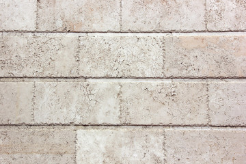 White wall of large blocks. The texture of the stone.