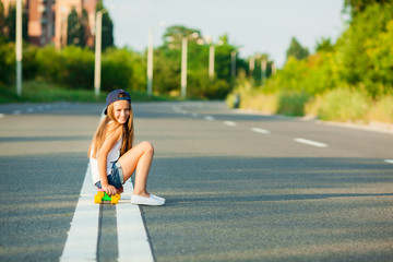 A young girl with penny board .