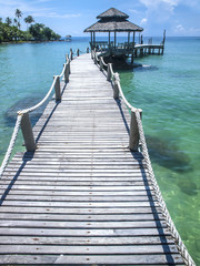 A wooden jetty leads to a gazebo in an azure ocean, Ko Kut island, eastern Thailand