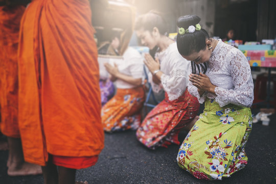 Thai Woman Pay Homage To A Buddhist Monk In Morning.