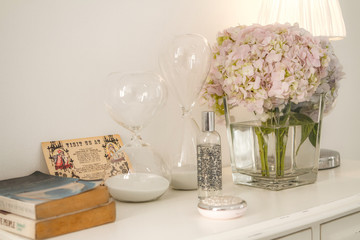 hourglasses on a sideboard