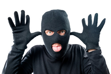 Close-up portrait of a criminal masked cheerful facial expression
