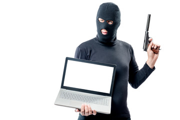 The criminal with the weapon holds a laptop, space for writing on the screen