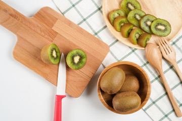 Top view fresh Kiwi fruit sliced on chopping board