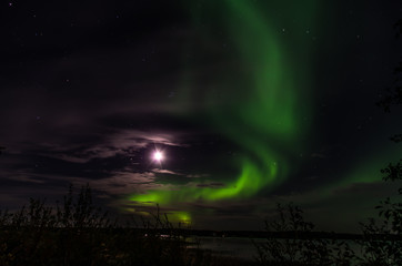 Glowing moon and the northern lights