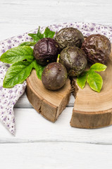 Passion fruits on wooden background