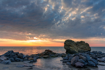 Beautiful sunrise in the sea with clouds