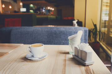Modern restaurant interior, coffee cup on table