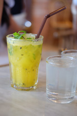 Topical cocktail with passion fruit lime and mint