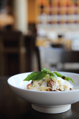 Chorizo sausage spaghetti fettuccine on wood background