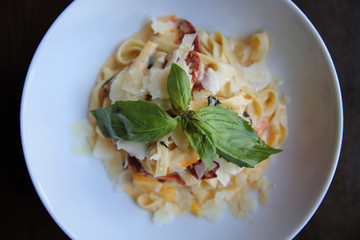 Chorizo sausage spaghetti fettuccine on wood background